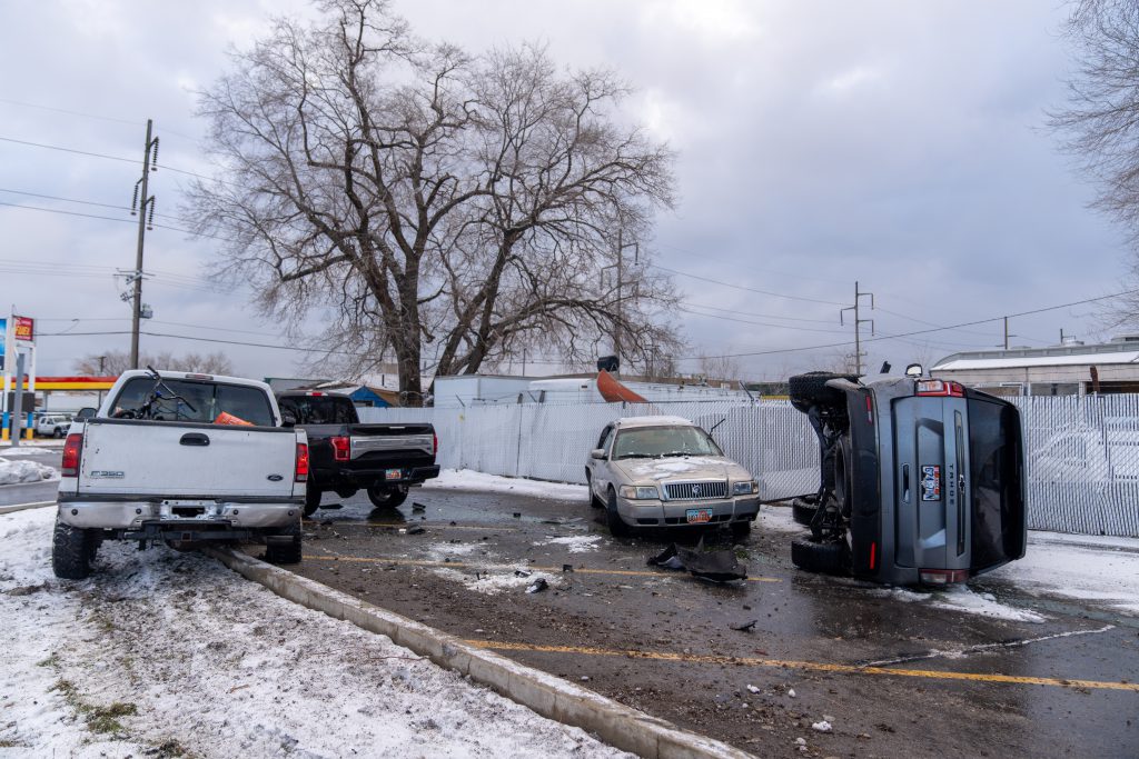 A photo of four cars involved in a crash.