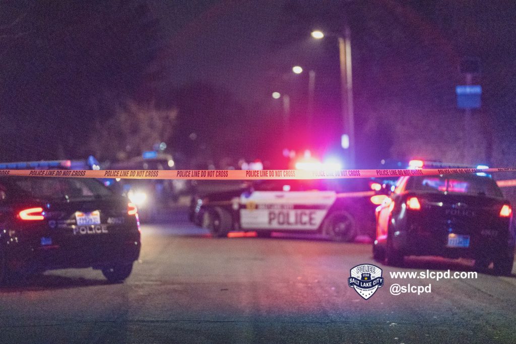 A photo of police cars blocking the scene of a shooting on Ivy Circle in Salt Lake City.