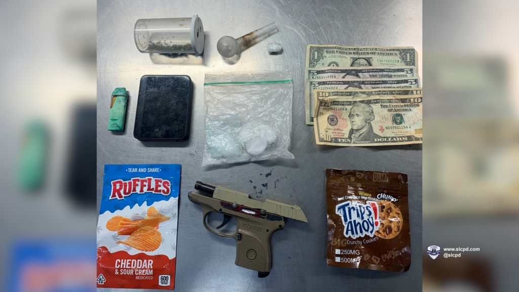 A photo of a gun, illegal drugs, cash, and drug paraphernalia recovered during a recent traffic stop in Salt Lake City.