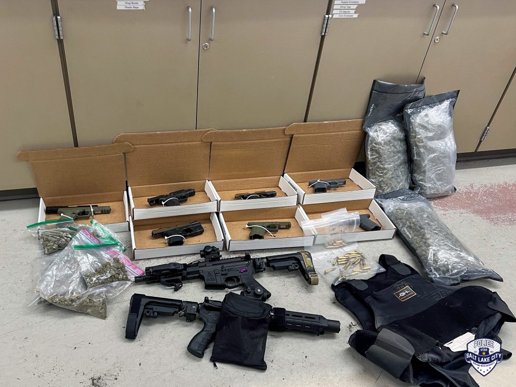 A photo of guns, body armor, and illegal drugs seized recently by the SLCPD Violent Criminal Apprehension Team.